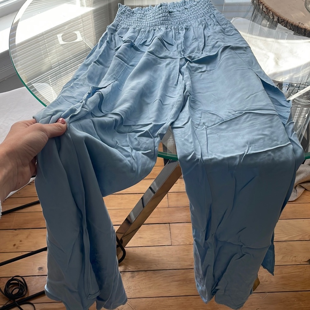 Flowy pants with thick flattering waist band.